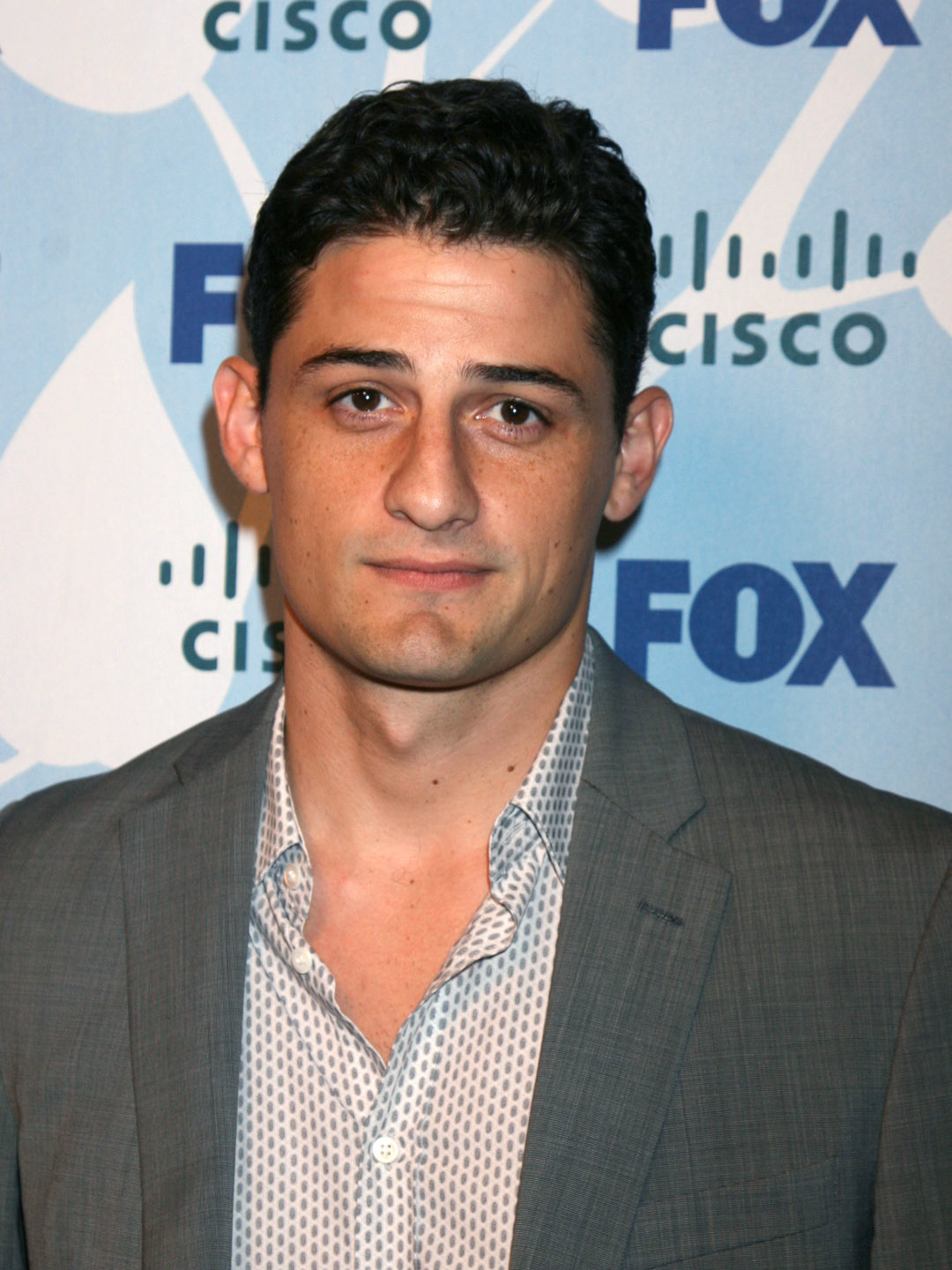 How tall is Enver Gjokaj?